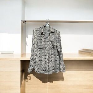 This cheetah blouse is perfect for a work function or night out.